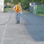 Parking lot asphalt spraying and restoration